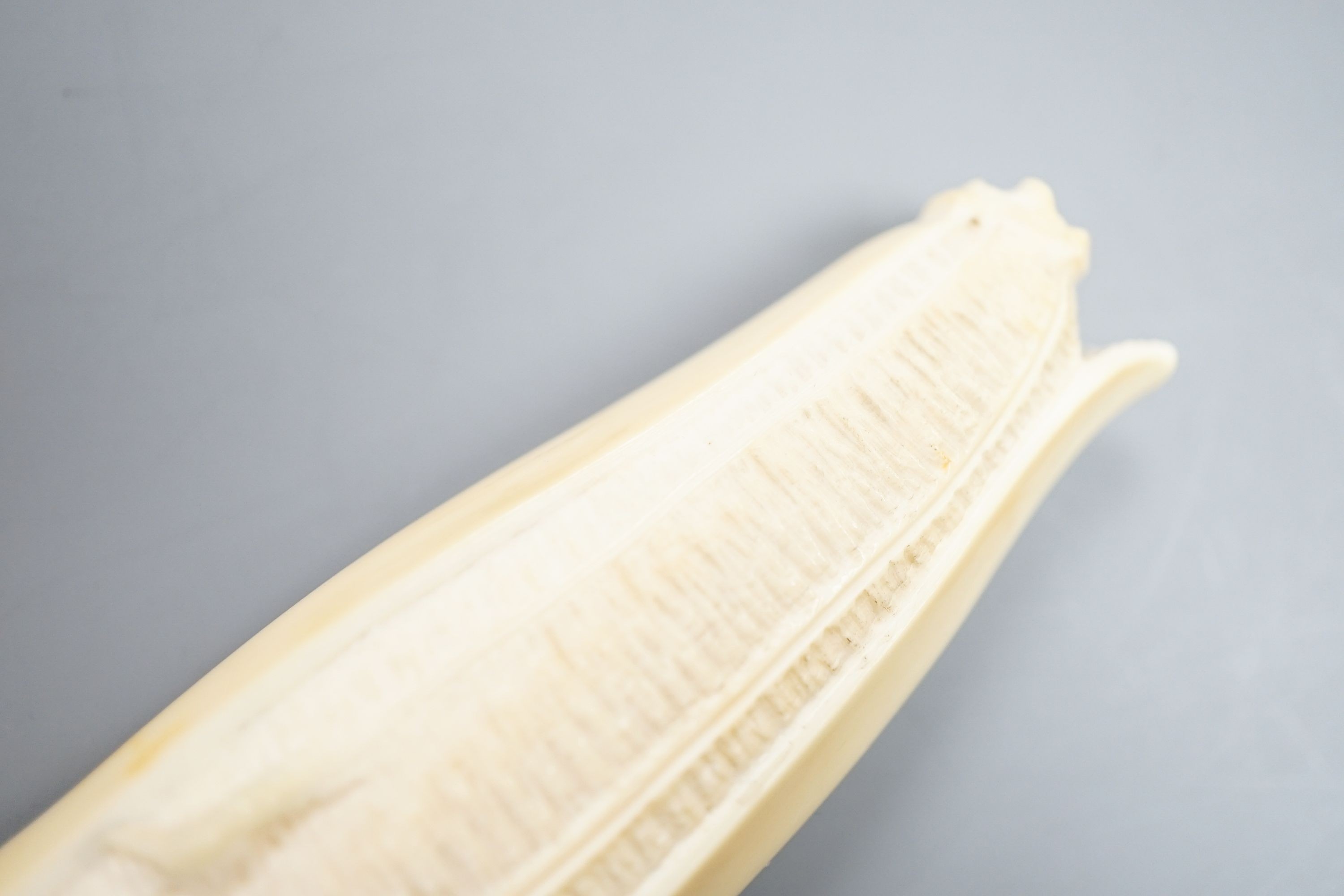 A Japanese carved ivory model of a partially peeled banana c.1900, 16cm